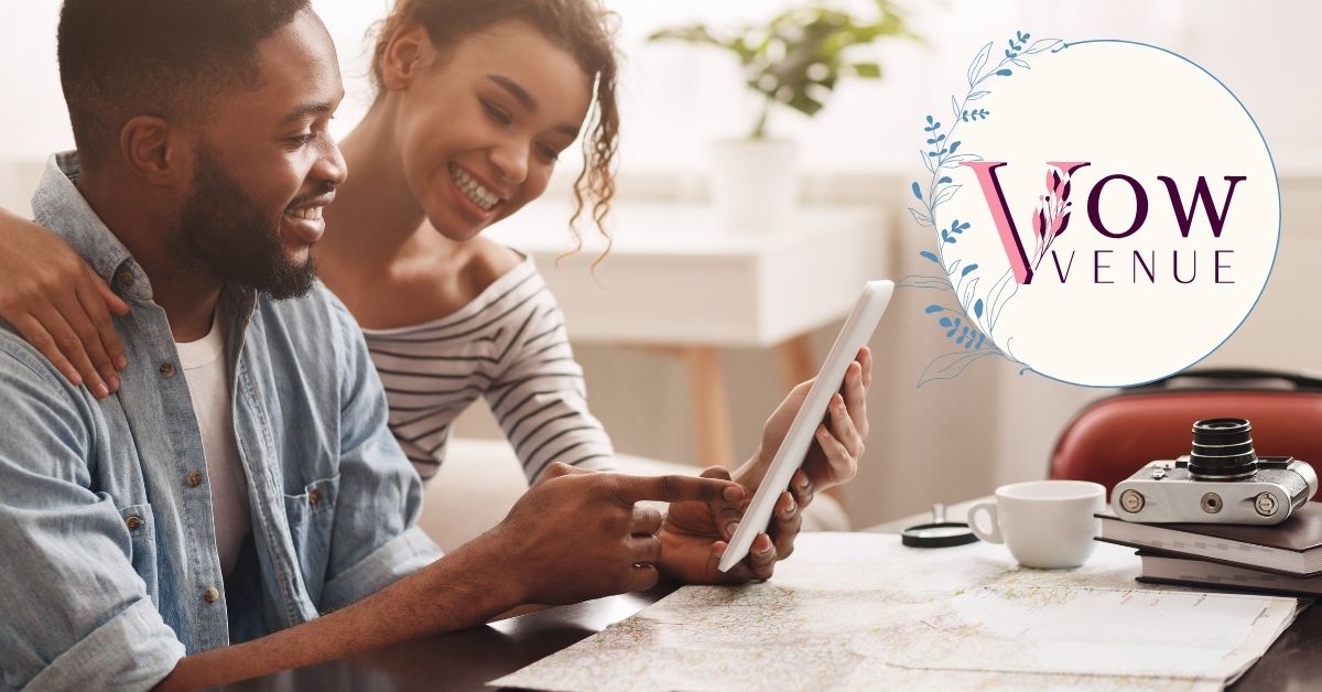 A couple is smiling as they look at a laptop, excitedly viewing the best wedding venues in their preferred area on the Vow Venue platform.