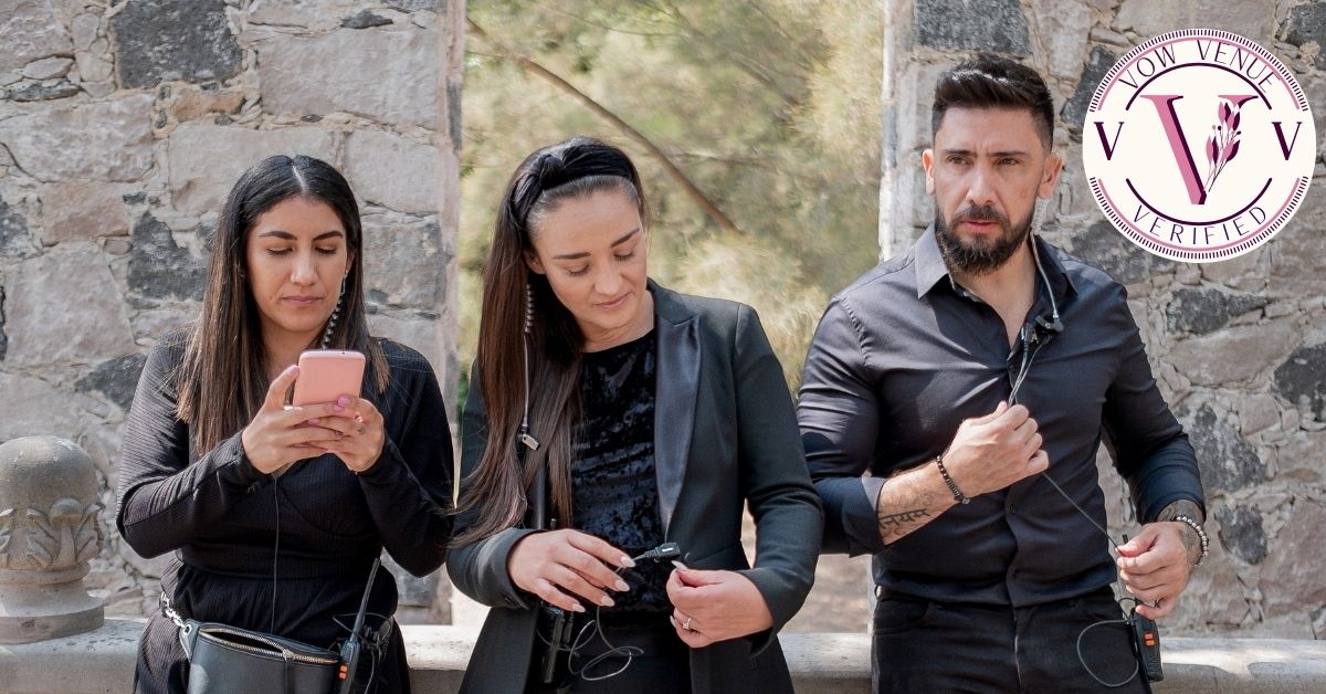 Three-person photography and videography team arriving at a wedding venue, carrying equipment and ready to capture the special moments of the event.